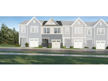 Charming townhome with a front-entry two car garage and stone accents at 236 Paramount Dr # 22, Smithfield, NC 27577
