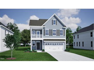 Charming two-story home with a covered porch, and a two-car garage for modern living at 255 Meadowbark Bnd # 31, Garner, NC 27529