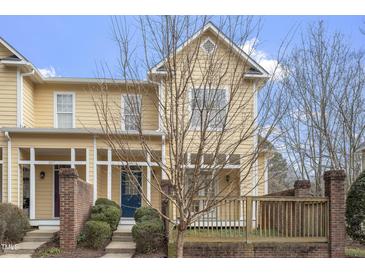 Charming townhome featuring a covered front porch and well-maintained landscaping at 269 Sweet Bay Pl, Carrboro, NC 27510