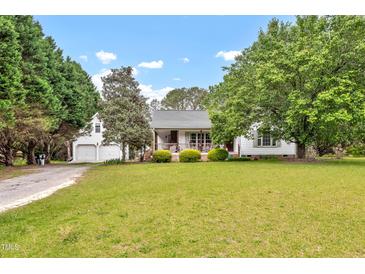 Charming single-Gathering home with a large front yard and attached two-car garage at 905 Tyler Ct, Garner, NC 27529