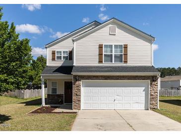 Charming two-story home featuring a two-car garage and well-maintained front lawn at 929 Mailwood Dr, Knightdale, NC 27545