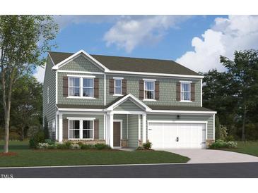 Charming two-story home with shaker siding, brown shutters, covered porch, and a two-car garage at 1236 Dimaggio Dr # 34, Raleigh, NC 27616