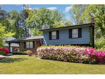 Charming two-story home with lush landscaping, brick accents and inviting curb appeal at 1636 Cone Ave, Apex, NC 27502