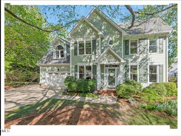Charming two-story home with a well-manicured lawn and inviting front porch at 4 N Poston Ct, Durham, NC 27705