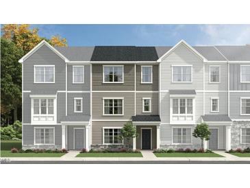 Charming townhouse complex with inviting curb appeal and diverse color schemes at 472 Carolina Springs Blvd, Apex, NC 27539