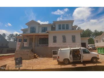 New two-story home with a porch and visible construction features at 7961 Wexford Waters Ln, Wake Forest, NC 27587