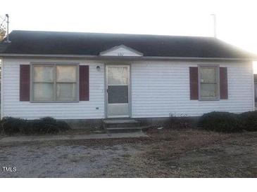Charming single story home with a dark roof and white siding at 801 E Highland Ave, Rocky Mount, NC 27801
