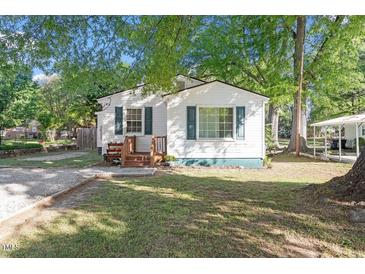 Charming single-story home with a well-maintained lawn and inviting front porch at 116 W Mciver St, Zebulon, NC 27597