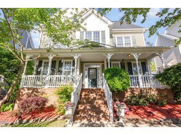 Charming home featuring a welcoming front porch and manicured landscaping at 161 Fort Jackson Rd, Morrisville, NC 27560