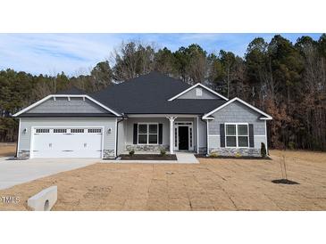 Charming single-story home with gray siding, black shutters, and a well-manicured lawn at 1681 Pecan Drive # 24, Nashville, NC 27856