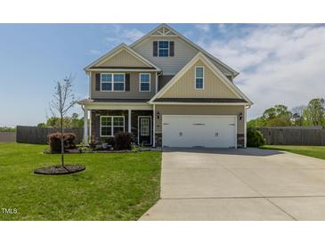 Charming two-story home with a well-manicured lawn and inviting curb appeal in a suburban neighborhood at 312 Loon Ct, Graham, NC 27253