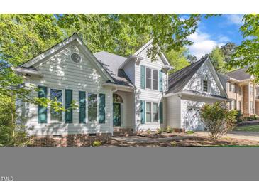 Charming two-story home with green shutters and a well-maintained yard at 8012 Glenbrittle Way, Raleigh, NC 27615