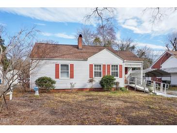 Charming single-story home with red shutters, accessible ramp, and brick foundation at 115 Higbee St, Durham, NC 27704
