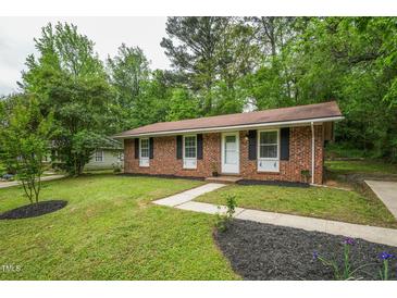 Charming single-story brick home with a well-maintained front yard and inviting walkway at 508 Solar Dr, Raleigh, NC 27610