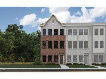 New townhome features a brick facade with a front door and a manicured lawn at 685 Bandon Aly, Cary, NC 27513