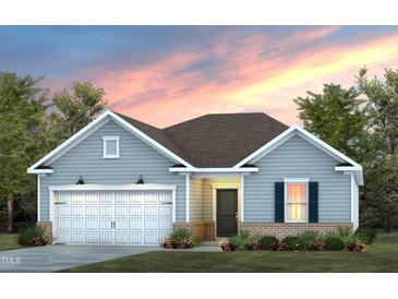 Charming single-story home featuring a two-car garage, well-manicured lawn, and craftsman-style details under a colorful sky at 740 Ben Ledi Ct, Raleigh, NC 27603