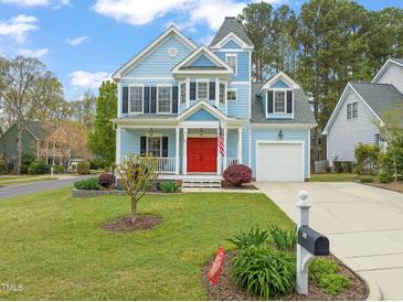 Charming two-story home with a well-manicured lawn and inviting curb appeal at 101 Rustic Pine Ct, Apex, NC 27502