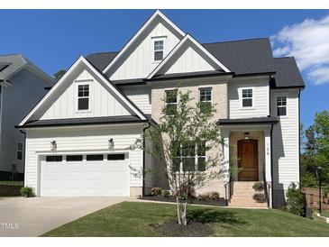 Charming two-story home featuring a two-car garage and a blend of siding and brick accents at 108 Clements Dr, Morrisville, NC 27560