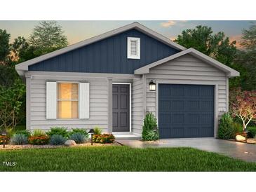 Charming single-story home featuring vinyl siding, a gray front door, and a well-manicured lawn at 224 Landon Pl, Roxboro, NC 27573