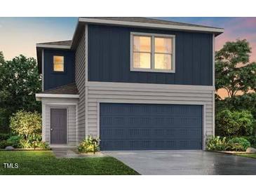 Charming two-story home with a gray trim, dark blue siding, and a two-car garage at 250 Landon Pl, Roxboro, NC 27573