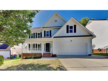 Charming two-story home with a well-manicured lawn and a two-car garage, perfect for Gathering living at 4828 Forest Highland Dr, Raleigh, NC 27604