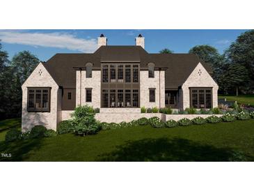 Stunning home with brick facade, dark trim and elegant landscaping provides privacy and curb appeal at 8413 Portmarnock Ct, Wake Forest, NC 27587