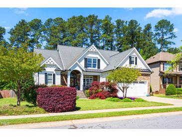 Charming two-story home with beautiful landscaping, stone accents and a two car garage at 215 Terrell Dr, Rolesville, NC 27571