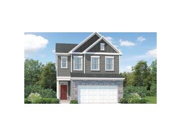 Charming two-story home with stone accents and a welcoming red front door at 533 Morning Light Dr # 33, Angier, NC 27501