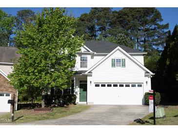 Charming two-story home with a well-manicured lawn and a two-car garage, showcasing curb appeal at 6 Dawson Ct Ct, Durham, NC 27703