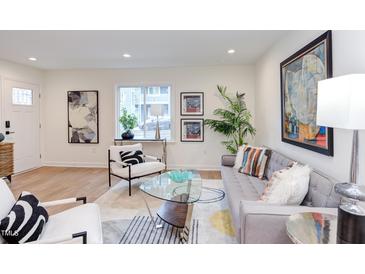 Bright living room featuring modern decor, stylish seating, and ample natural light at 1309 Hudson Ave # D1, Durham, NC 27705
