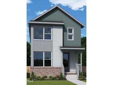 Charming two-story home with a stylish gray exterior, a brick foundation, and a welcoming front porch at 14 Relaxing Way, Pittsboro, NC 27312