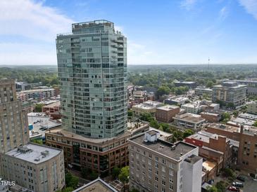 Striking high-rise building with modern architecture and city views on a beautiful sunny day at 110 N Corcoran St # 2101, Durham, NC 27701