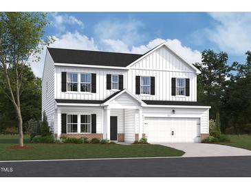 Beautiful two-story home featuring white siding, black shutters, and a two-car garage at 1248 Dimaggio Dr # 37, Raleigh, NC 27616