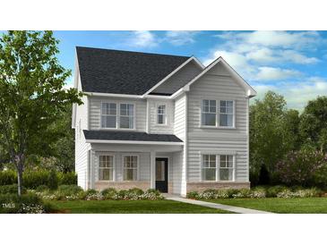 Charming two-story home with white siding, a dark roof, and a landscaped front yard at 1248 Hardin Hill Ln, Knightdale, NC 27545