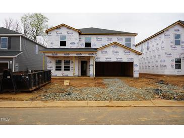 New construction home featuring a two-car garage in a residential neighborhood during construction at 2214 Cherry Creek Rd, Haw River, NC 27258