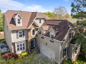 Beautiful two-story home with stone accents, dormer windows and attached two car garage at 2817 Peachleaf St, Raleigh, NC 27614