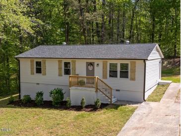Charming ranch-style home featuring light siding, complementary shutters, and a quaint front porch at 120 King Charles Rd, Hillsborough, NC 27278