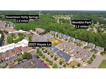 Aerial view of 2027 Hayes Ln showing proximity to Downtown Holly Springs and Womble Park at 2027 Hayes Ln, Holly Springs, NC 27540
