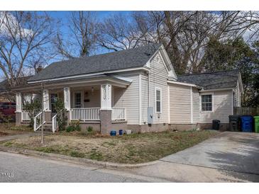 Charming single-story home with a cozy front porch and well-maintained yard at 305 Freeman St, Raleigh, NC 27601