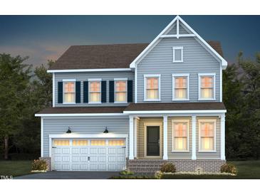 Charming two-story home featuring a symmetrical facade, welcoming front porch, and attached two-car garage at 755 Bachelor Gulch Way, Apex, NC 27523