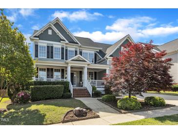 Charming two-story home with landscaped yard, covered porch, and beautiful curb appeal at 602 Alden Bridge Dr, Cary, NC 27519