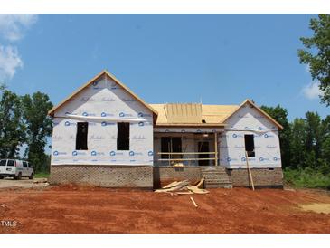New home under construction with brick foundation on a sunny day at 95 Autumnwood Ln, Spring Hope, NC 27882