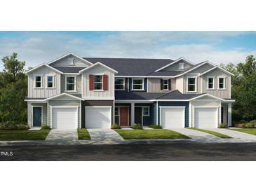 Beautiful new townhomes featuring multiple garage doors, colorful exteriors, and sidewalk-lined street at 1031 Mountain Crown St, Durham, NC 27703