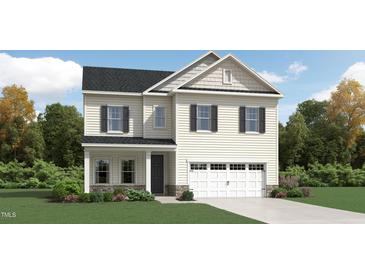 Charming two-story home with neutral siding, black shutters and a two car garage at 1316 Rose Gold Ln, Raleigh, NC 27610