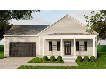 Charming single-story home with a covered porch, black shutters, and attached garage at 200 Green Pines Estates Dr, Kenly, NC 27542