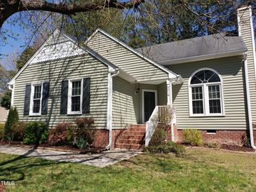 Charming home featuring a quaint entrance, well-maintained landscaping, and brick accents at 2416 Fields Of Broadlands Dr, Raleigh, NC 27604
