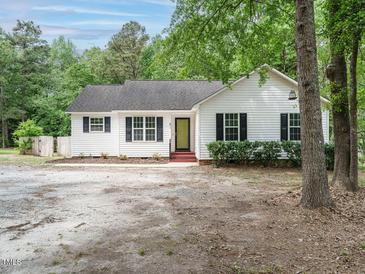 Charming single-story home featuring a white exterior, black shutters, and well-maintained landscaping at 81 Sallie Dr, Smithfield, NC 27577