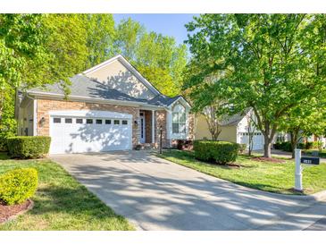 Charming single-Gathering home boasting a manicured lawn, a two-car garage, and stone accents at 146 Rockport Ridge Way, Cary, NC 27519