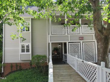 Charming condo with a white railed walkway and a cozy covered porch at 403 Gooseneck Dr # A-1, Cary, NC 27513
