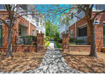 Charming community with lush landscaping and brick facade townhomes at 708 Copperline Dr # 101, Chapel Hill, NC 27516